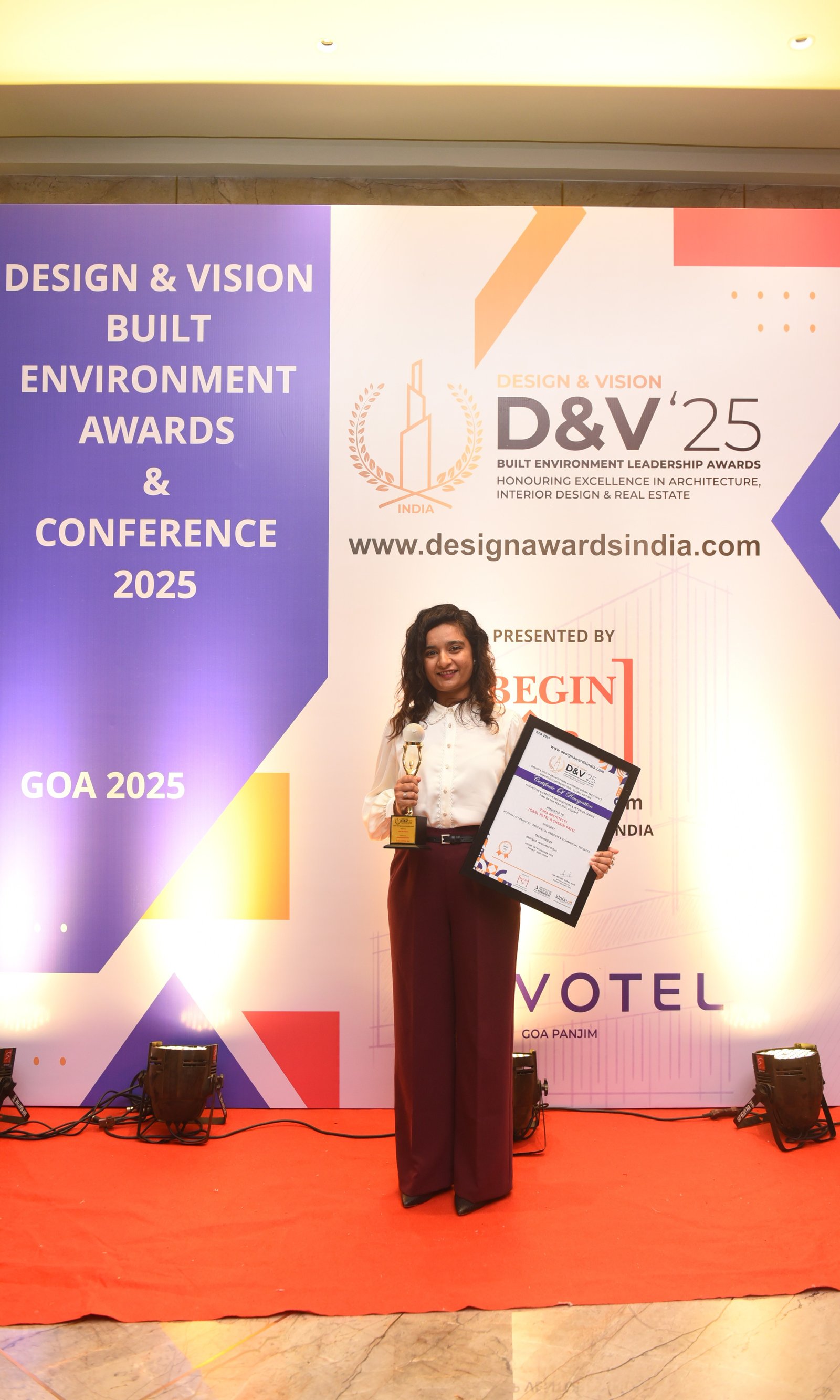 Designer holding award